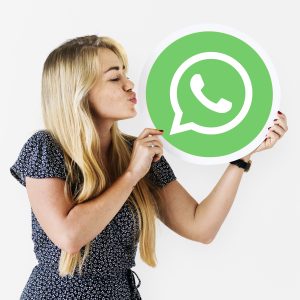 Woman blowing a kiss to a WhatsApp Messenger icon